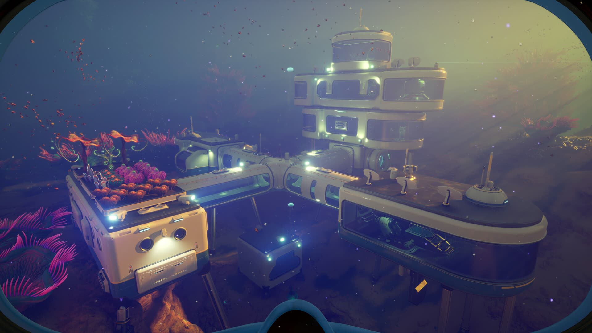 Official Subnautica 2 screenshot of a modular seabase exterior surrounded by plants and fish — visual context for Upcoming stomp-style vehicle chassis in Abyss Atlas